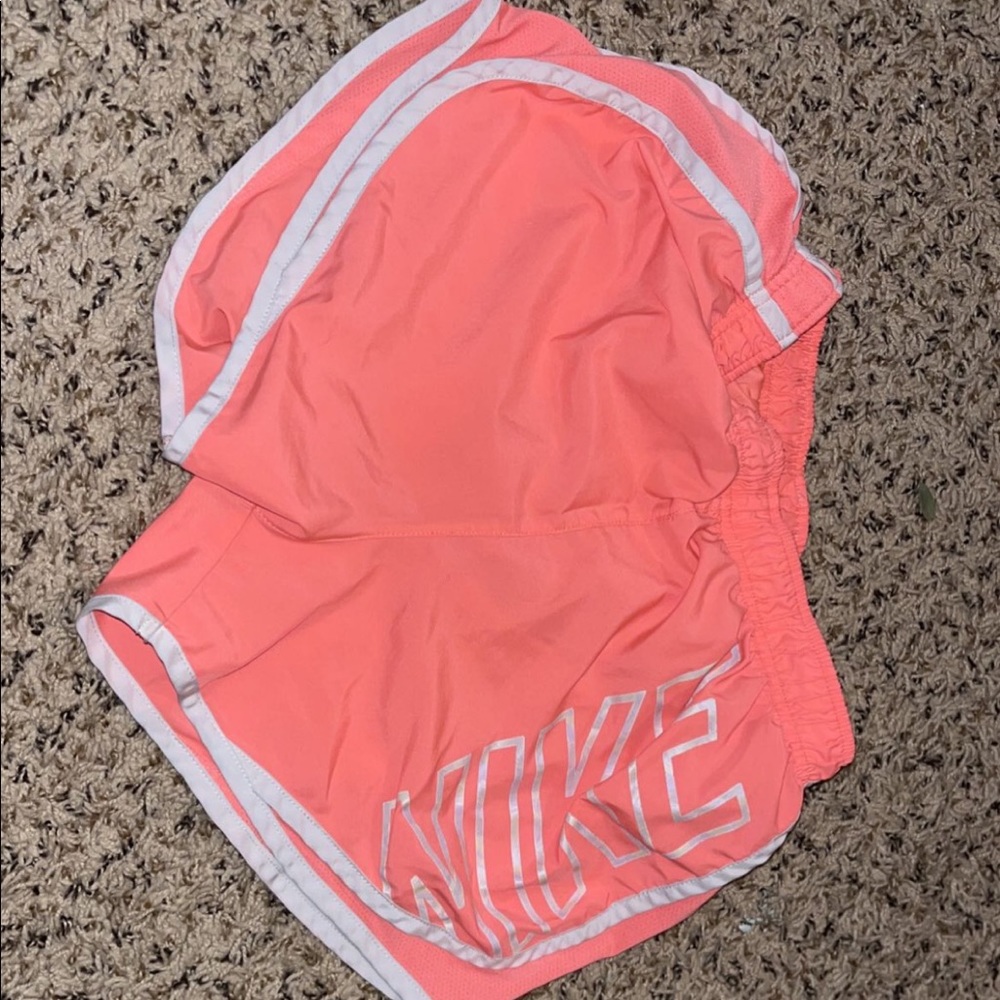 Pink Nike running shorts